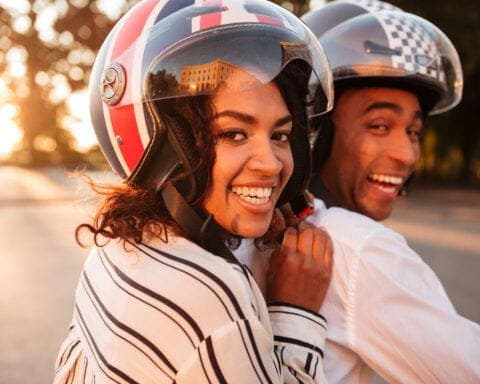 Close up side view image of happy african couple