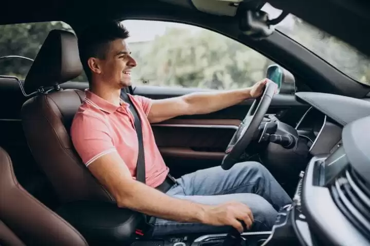 Handsome Man Driving In His Car